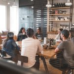 Commercial property buying guide illustrated with documents, blueprints, and a Lahore office tower