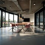 Modern corporate office interior in Lahore with a team meeting around a glass table