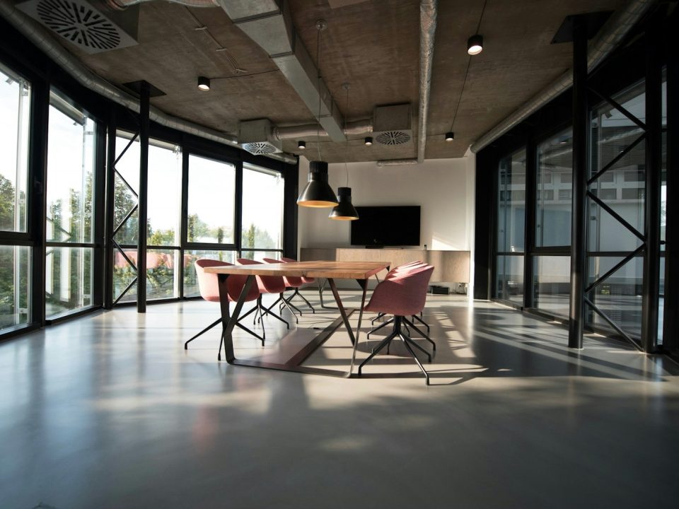 Modern corporate office interior in Lahore with a team meeting around a glass table